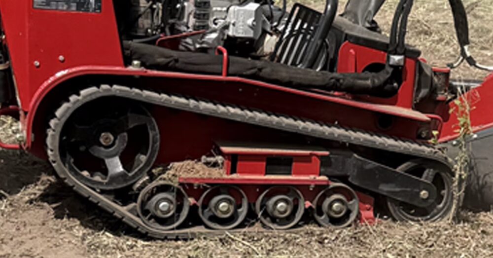 Toro STX-38 track system providing stability during stump grinding